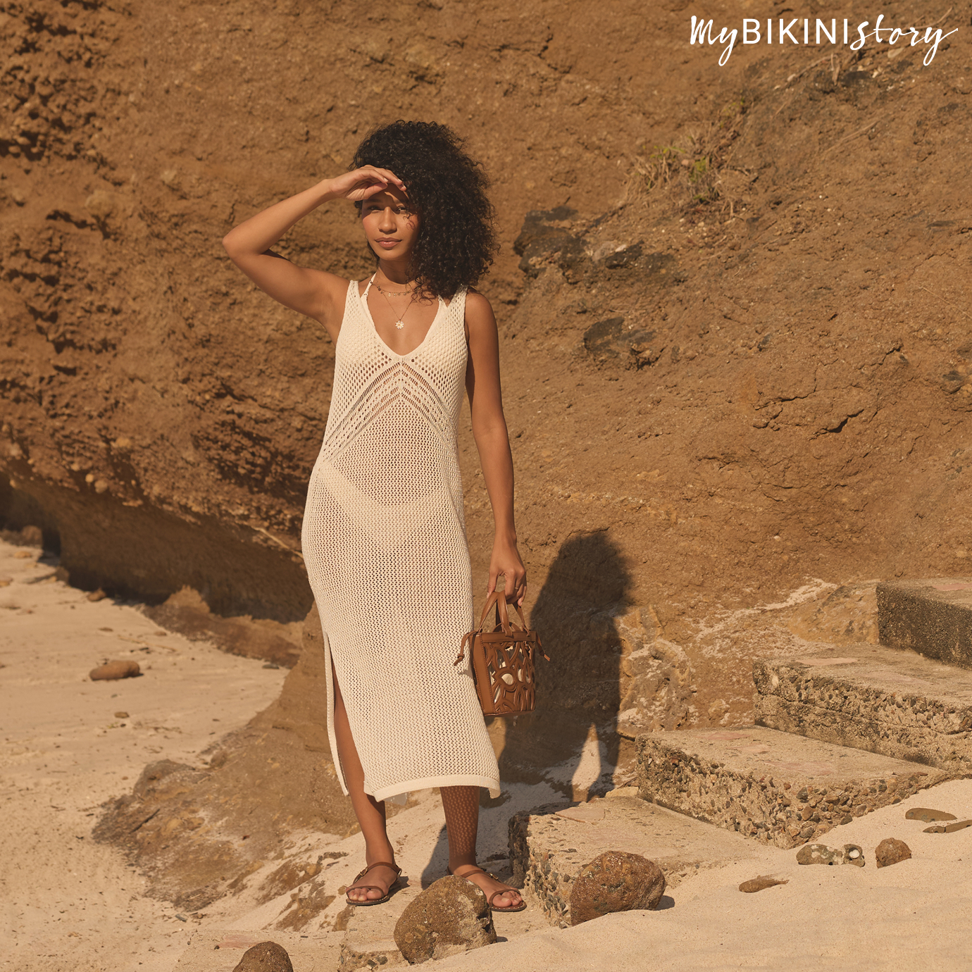 A woman wearing a white crochet dress from My Bikini Story – Bikini Village 